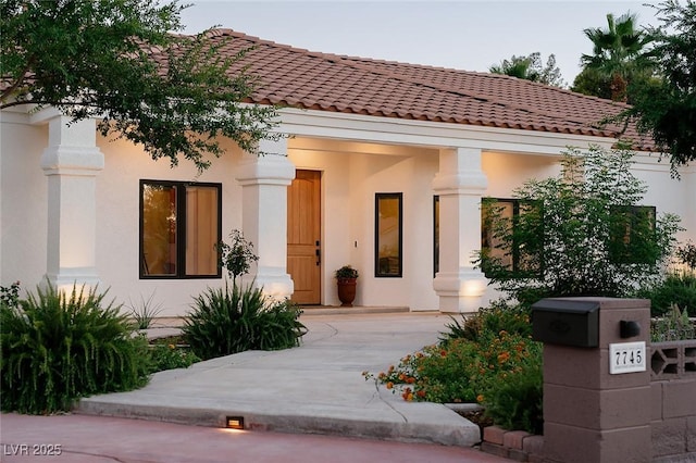 7745 Radcliff St, Las Vegas, NV 89123 - view of front facade with stucco siding and a tiled roof