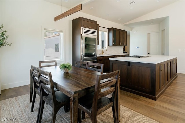 7745 Radcliff St, Las Vegas, NV 89123 - dining area featuring lofted ceiling and light wood-type flooring