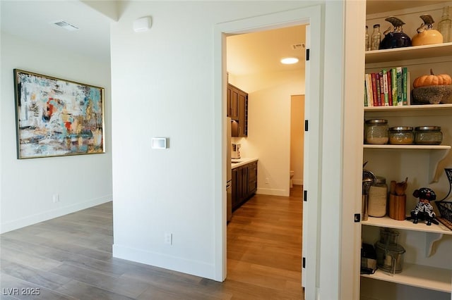 7745 Radcliff St, Las Vegas, NV 89123 - hall featuring wood finished floors and baseboards