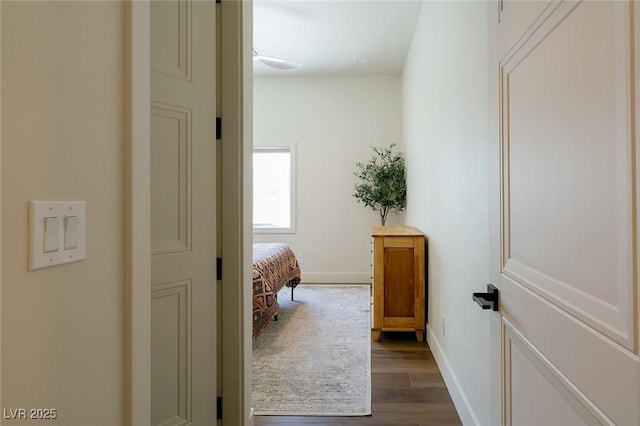 7745 Radcliff St, Las Vegas, NV 89123 - corridor with dark wood-style floors and baseboards