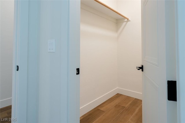 7745 Radcliff St, Las Vegas, NV 89123 - walk in closet with wood finished floors