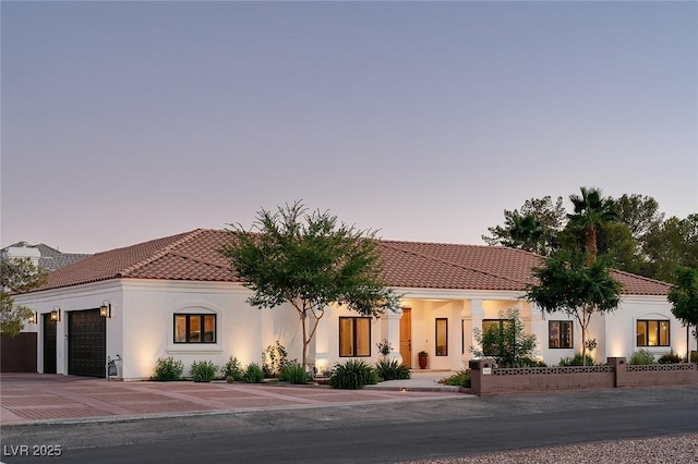 7745 Radcliff St, Las Vegas, NV 89123 - mediterranean / spanish-style home with a tiled roof, a garage, stucco siding, and driveway