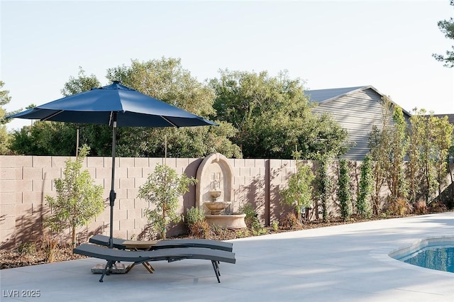 7745 Radcliff St, Las Vegas, NV 89123 - fenced backyard with a patio