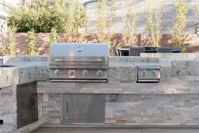 7745 Radcliff St, Las Vegas, NV 89123 - view of patio / terrace featuring exterior kitchen and a sink