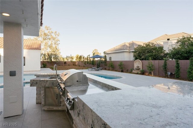 7745 Radcliff St, Las Vegas, NV 89123 - view of swimming pool featuring area for grilling, a fenced backyard, and a patio