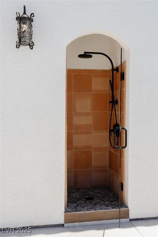 7745 Radcliff St, Las Vegas, NV 89123 - bathroom with a shower stall and a textured wall
