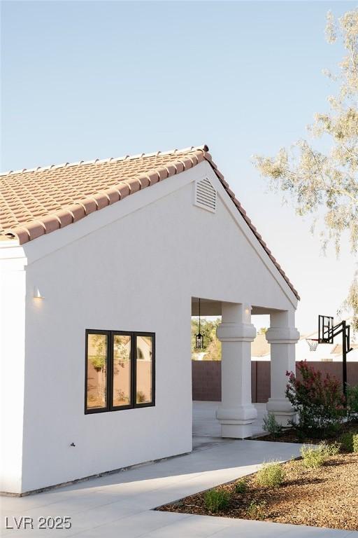 7745 Radcliff St, Las Vegas, NV 89123 - back of property featuring stucco siding and a tile roof