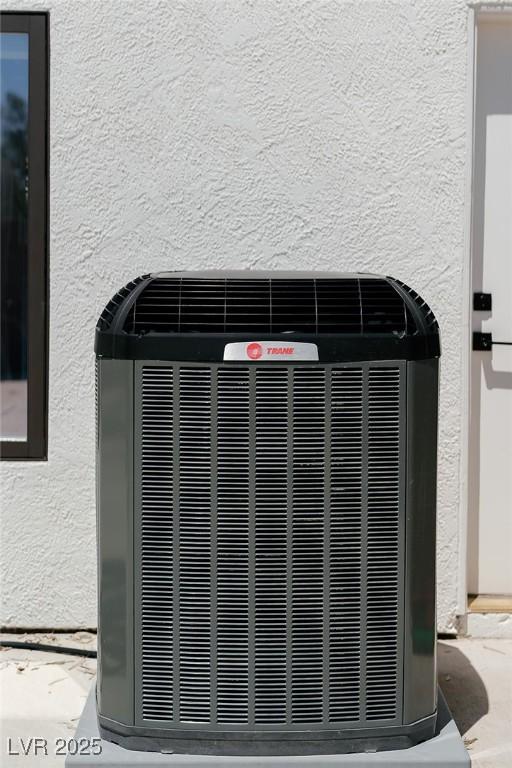 7745 Radcliff St, Las Vegas, NV 89123 - exterior view of a central air condition unit and stucco siding