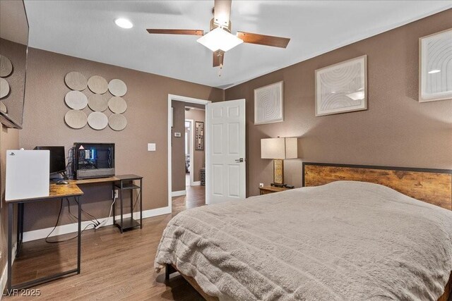 8013 Green River Knob St, Las Vegas, NV 89113 - bedroom with wood finished floors, a desk, and recessed lighting