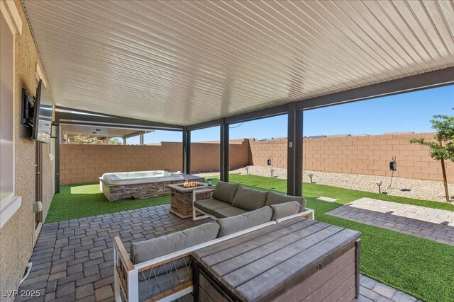 8013 Green River Knob St, Las Vegas, NV 89113 - fenced backyard with a patio area and an outdoor living space with a fire pit