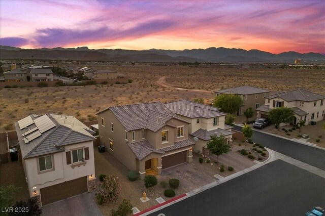 8013 Green River Knob St, Las Vegas, NV 89113 - aerial view at dusk of a mountain view, a residential view, and a desert view