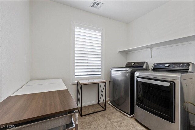 8013 Green River Knob St, Las Vegas, NV 89113 - washroom with washing machine and clothes dryer and baseboards