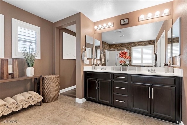 8013 Green River Knob St, Las Vegas, NV 89113 - full bath with double vanity, a stall shower, and tile patterned flooring