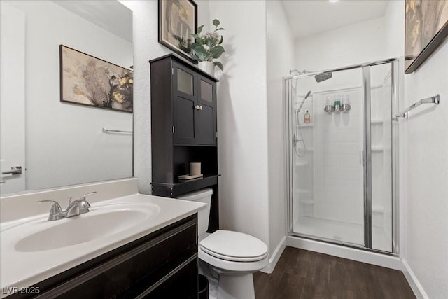 8013 Green River Knob St, Las Vegas, NV 89113 - bathroom with wood finished floors, a stall shower, and vanity
