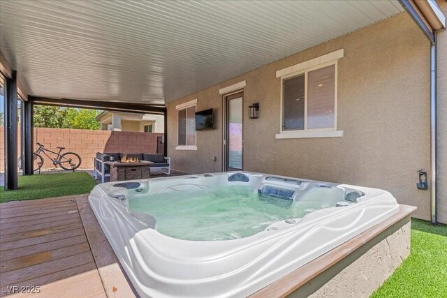 8013 Green River Knob St, Las Vegas, NV 89113 - deck with an outdoor hot tub and a fire pit