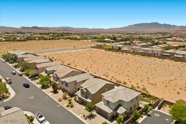 8013 Green River Knob St, Las Vegas, NV 89113 - aerial perspective of suburban area featuring mountains and a desert landscape