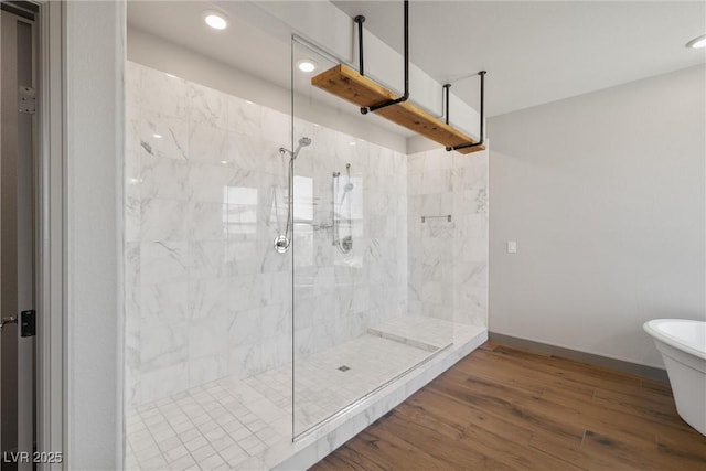 8753 Mann St, Las Vegas, NV 89139 - bathroom featuring a marble finish shower, wood finished floors, a freestanding tub, and recessed lighting