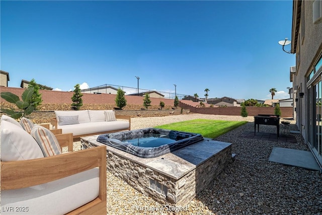 8753 Mann St, Las Vegas, NV 89139 - fenced backyard featuring an outdoor hot tub, a patio, and outdoor lounge area
