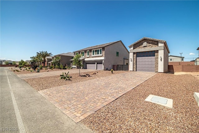 8753 Mann St, Las Vegas, NV 89139 - view of front of property with stone siding and decorative driveway