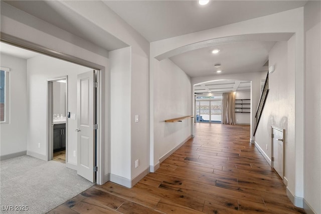 8753 Mann St, Las Vegas, NV 89139 - hallway featuring arched walkways, hardwood / wood-style floors, recessed lighting, and stairway