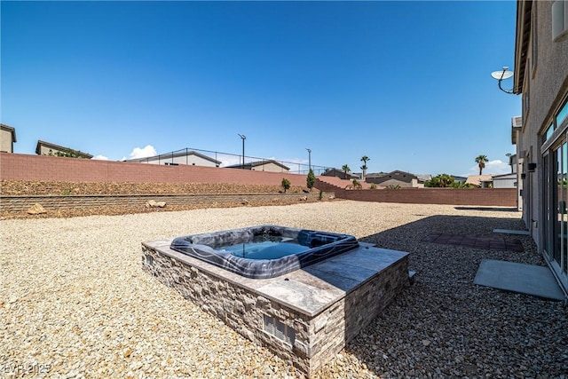 8753 Mann St, Las Vegas, NV 89139 - fenced backyard with an outdoor hot tub