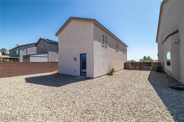 8753 Mann St, Las Vegas, NV 89139 - view of side of home featuring a fenced backyard and stucco siding