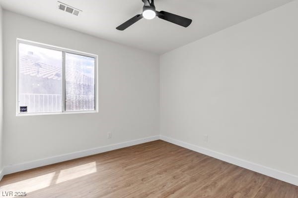 4911 Rancho Domingo Ct, North Las Vegas, NV 89031 - spare room featuring light wood-style flooring and a ceiling fan