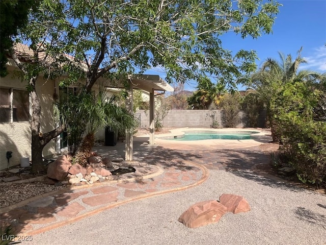 13 Desert Dawn Ln, Henderson, NV 89074 - view of swimming pool with a fenced backyard and a patio