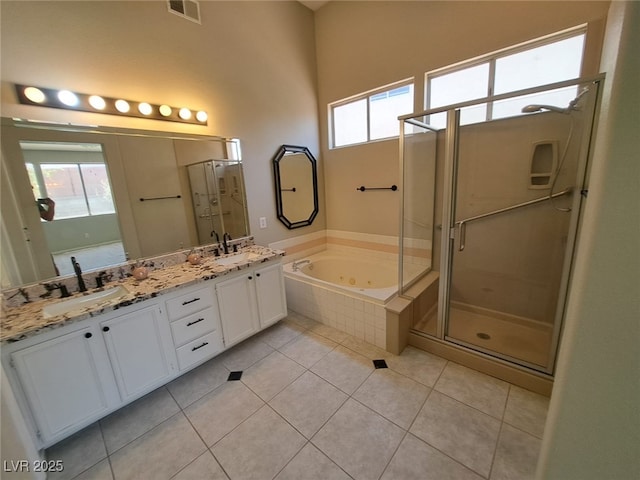 13 Desert Dawn Ln, Henderson, NV 89074 - full bathroom with double vanity, a shower stall, a tub with jets, and tile patterned flooring