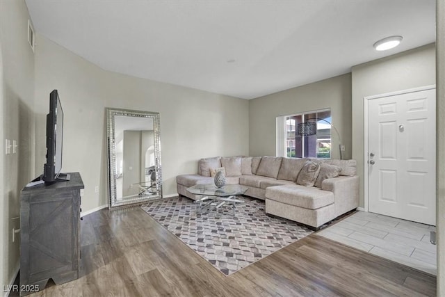 10553 Pine Glen Ave Unit 101, Las Vegas, NV 89144 - living area featuring wood finished floors and a wood stove