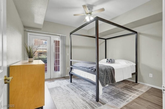 10553 Pine Glen Ave Unit 101, Las Vegas, NV 89144 - bedroom with wood finished floors, access to outside, and ceiling fan