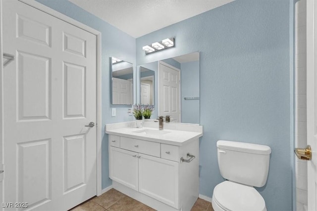 10553 Pine Glen Ave Unit 101, Las Vegas, NV 89144 - full bath with vanity, tile patterned flooring, and a textured wall