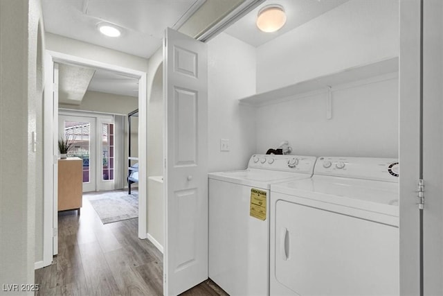 10553 Pine Glen Ave Unit 101, Las Vegas, NV 89144 - laundry room featuring separate washer and dryer and wood finished floors