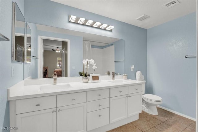 10553 Pine Glen Ave Unit 101, Las Vegas, NV 89144 - ensuite bathroom featuring double vanity, tile patterned floors, and a ceiling fan