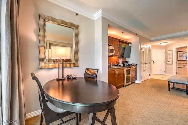 135 E Harmon Ave Unit 809, Las Vegas, NV 89109 - dining space featuring wine cooler and crown molding