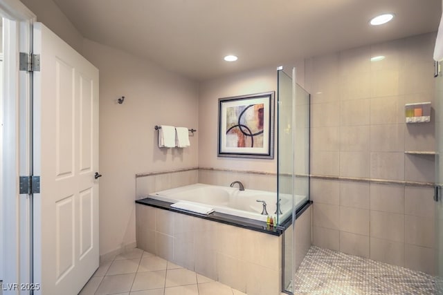 135 E Harmon Ave Unit 809, Las Vegas, NV 89109 - bathroom with tile patterned floors, a bath, a stall shower, and recessed lighting