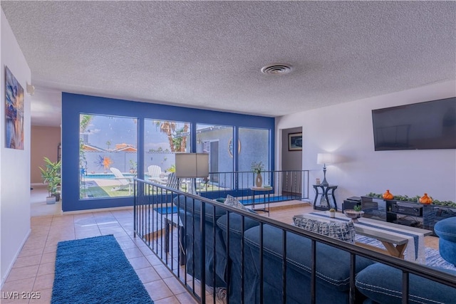 3030 Liberty Cir, Las Vegas, NV 89121 - living room with tile patterned flooring and a textured ceiling