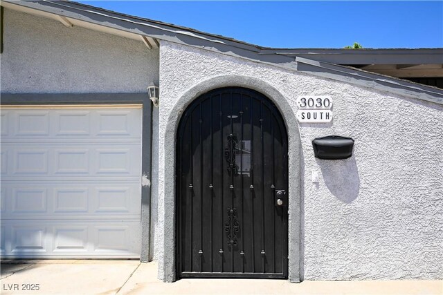3030 Liberty Cir, Las Vegas, NV 89121 - property entrance with stucco siding