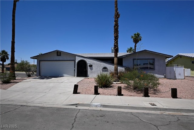 3030 Liberty Cir, Las Vegas, NV 89121 - single story home featuring a garage, stucco siding, and concrete driveway