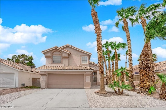 8379 Drop Camp St, Las Vegas, NV 89123 - mediterranean / spanish-style home with stucco siding, driveway, and a tile roof