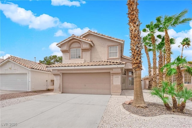 8379 Drop Camp St, Las Vegas, NV 89123 - mediterranean / spanish-style house featuring stucco siding, a tile roof, driveway, and an attached garage