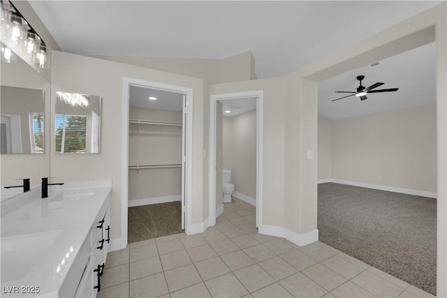 8379 Drop Camp St, Las Vegas, NV 89123 - full bath with double vanity, tile patterned floors, a ceiling fan, recessed lighting, and a spacious closet