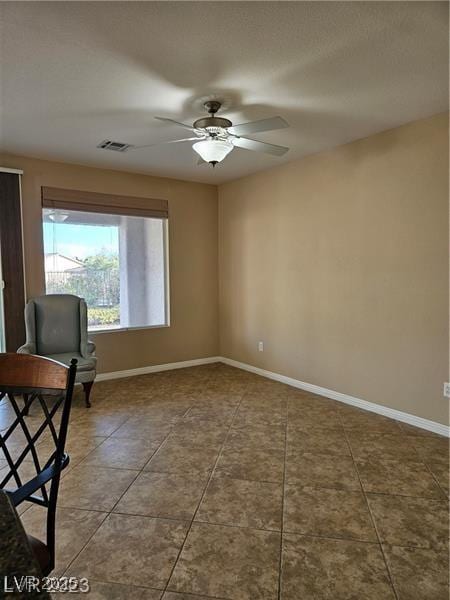 5110 Silenzio St, Las Vegas, NV 89135 - spare room with ceiling fan and tile patterned floors