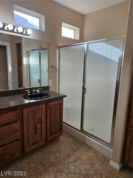 5110 Silenzio St, Las Vegas, NV 89135 - bathroom featuring vanity, a shower stall, and tile patterned floors