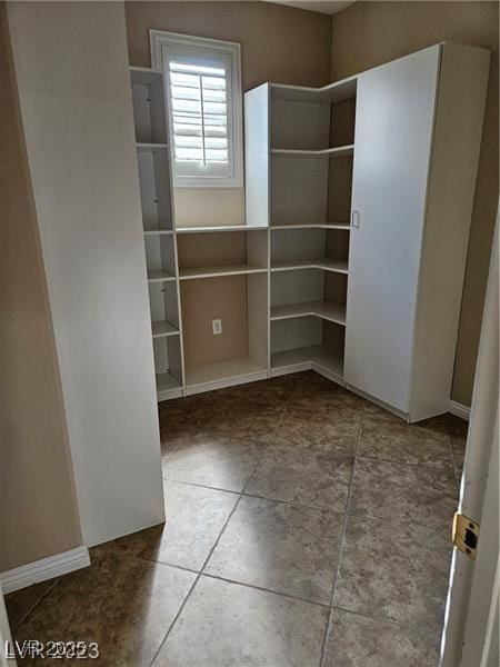 5110 Silenzio St, Las Vegas, NV 89135 - empty room featuring baseboards and tile patterned floors