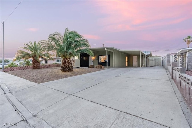 1628 Izabella Ave, Las Vegas, NV 89169 - view of front facade with concrete driveway and a carport