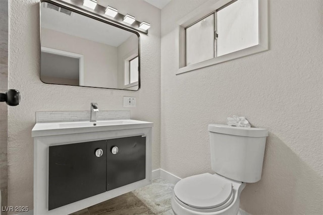 1628 Izabella Ave, Las Vegas, NV 89169 - bathroom with vanity and a textured wall