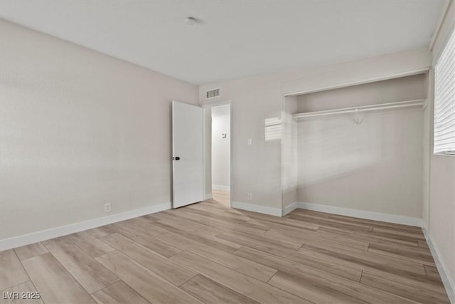 1628 Izabella Ave, Las Vegas, NV 89169 - unfurnished bedroom with wood finished floors and a closet