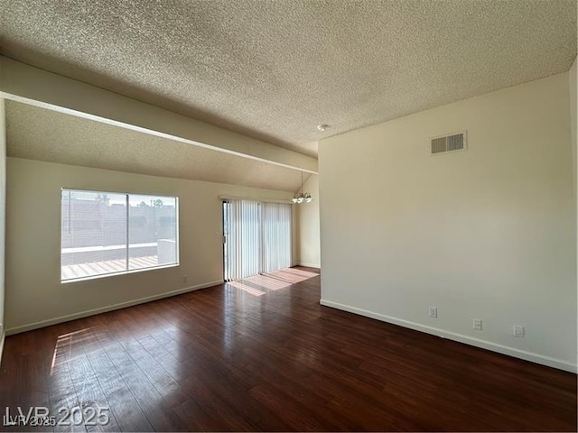 4230 Gannet Cir Unit 216, Las Vegas, NV 89103 - unfurnished room with dark wood-style flooring, a chandelier, and a textured ceiling