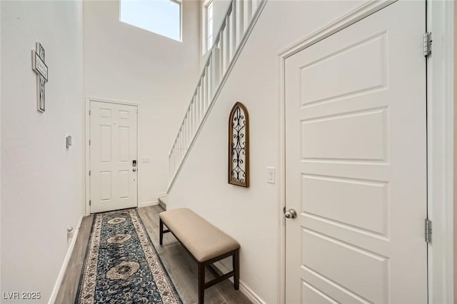 4364 Contour Bend Ave, North Las Vegas, NV 89084 - doorway featuring stairs, wood finished floors, and a towering ceiling